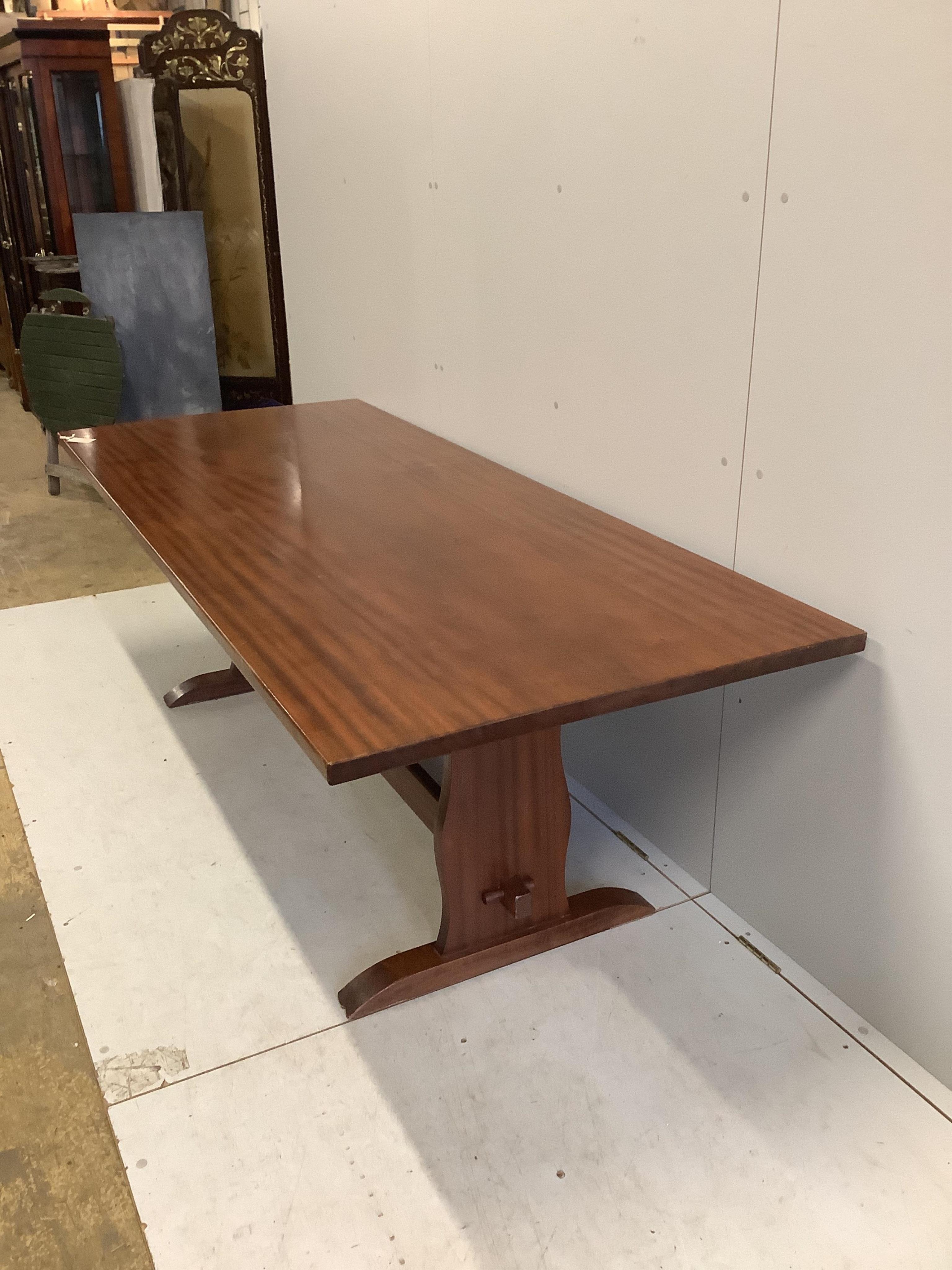 A rectangular hardwood refectory dining table, width 214cm, depth 89cm, height 71cm, together with eight early 20th century oak dining chairs. Condition - fair to good